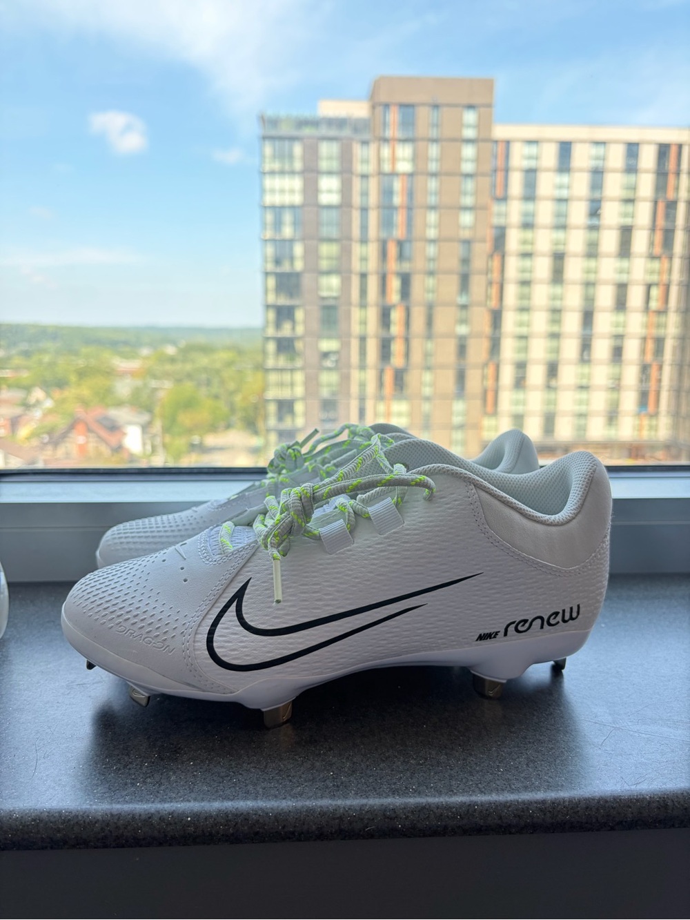 Nike Renew Softball Cleats with Black Swoosh and Neon Green Laces
